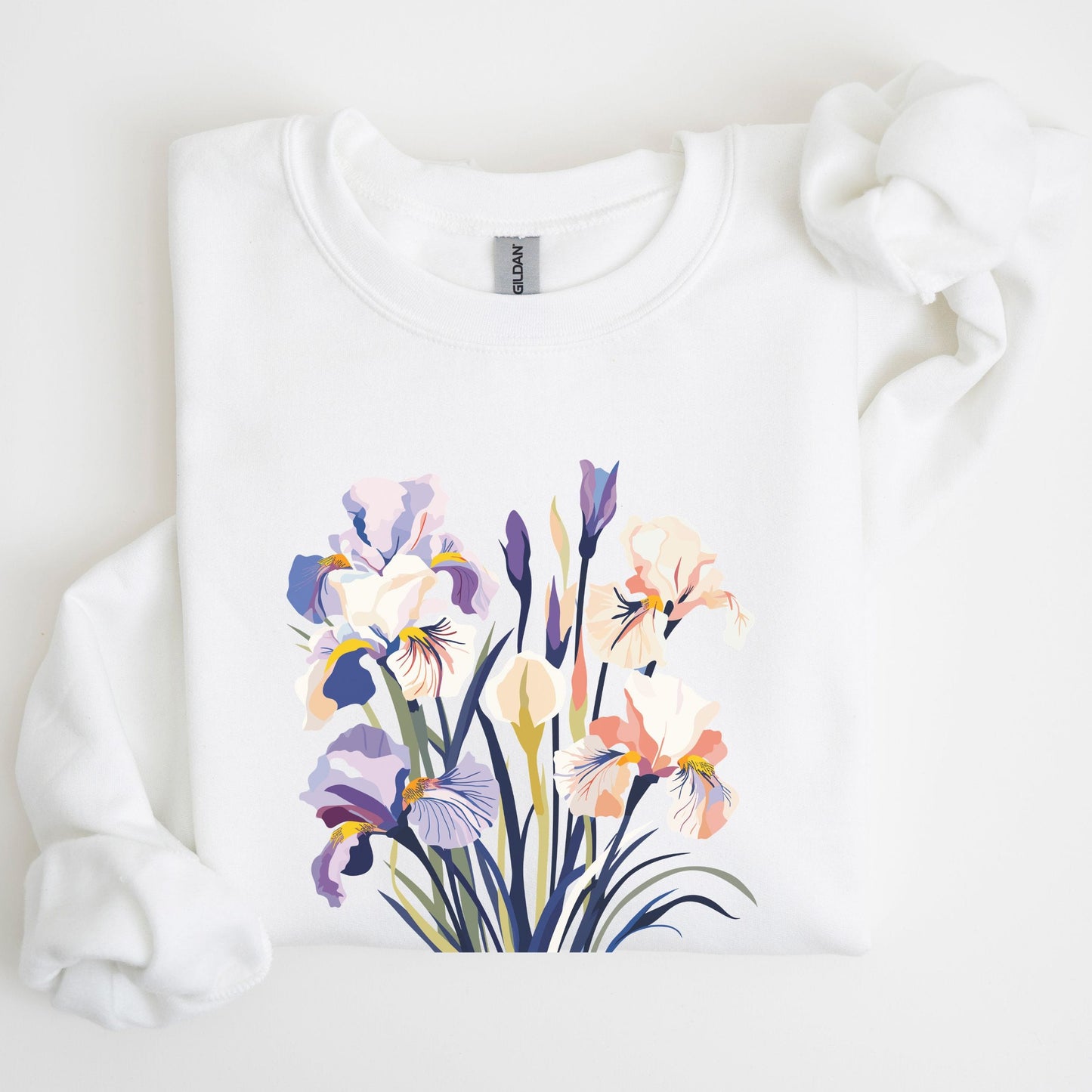 White sweatshirt with a colorful floral design on a light background