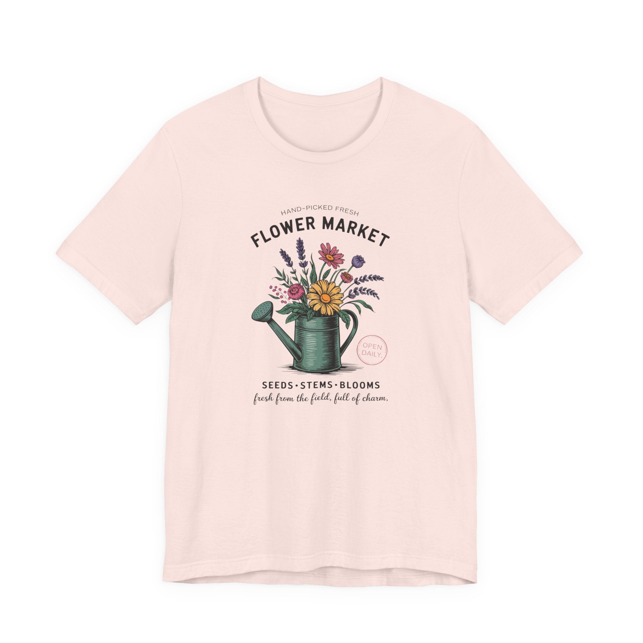 Pink t-shirt with floral design and text on a white background