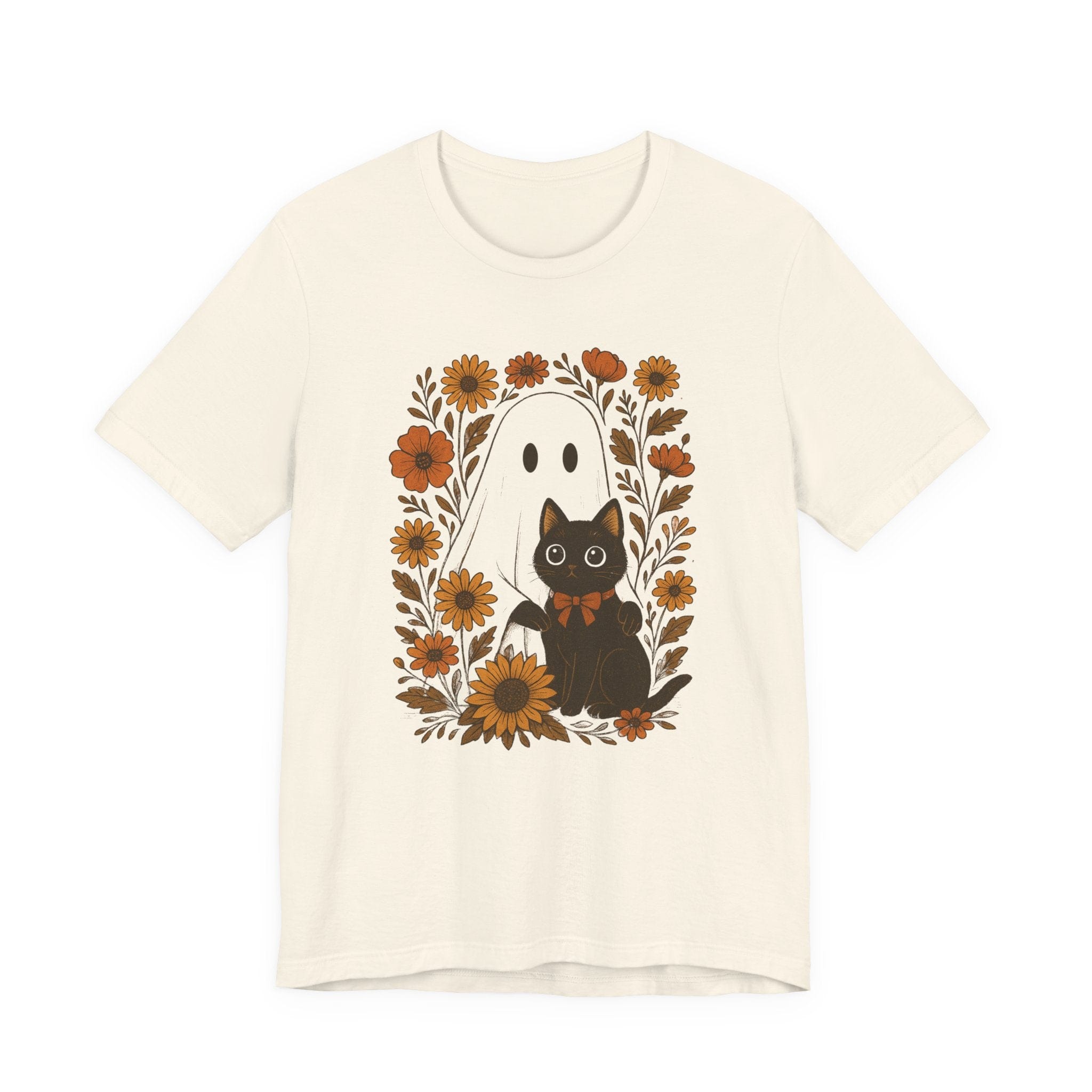 Flat lay of natural t-shirt with ghost and black cat surrounded by orange flowers