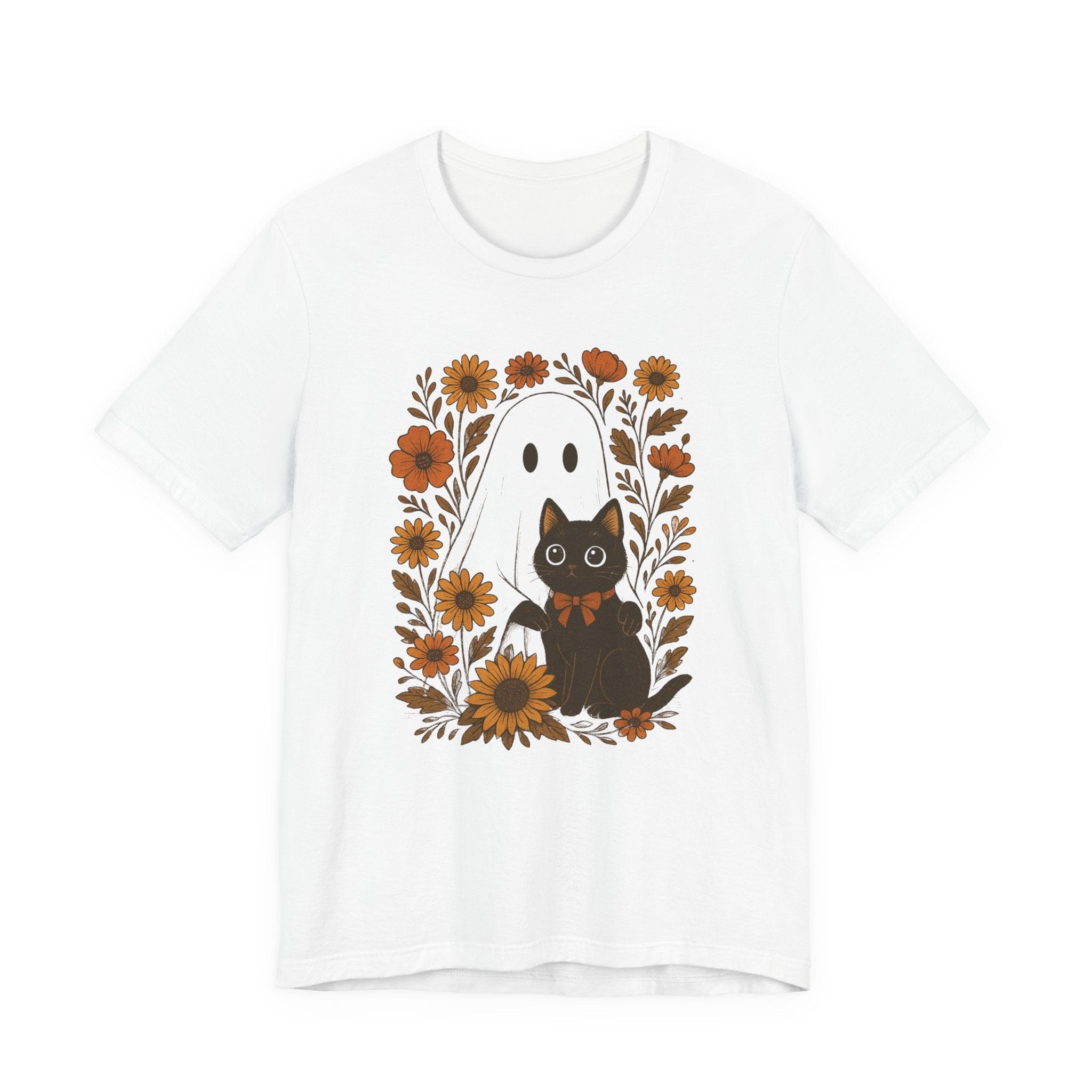 Flat lay of white t-shirt with ghost and black cat surrounded by orange flowers