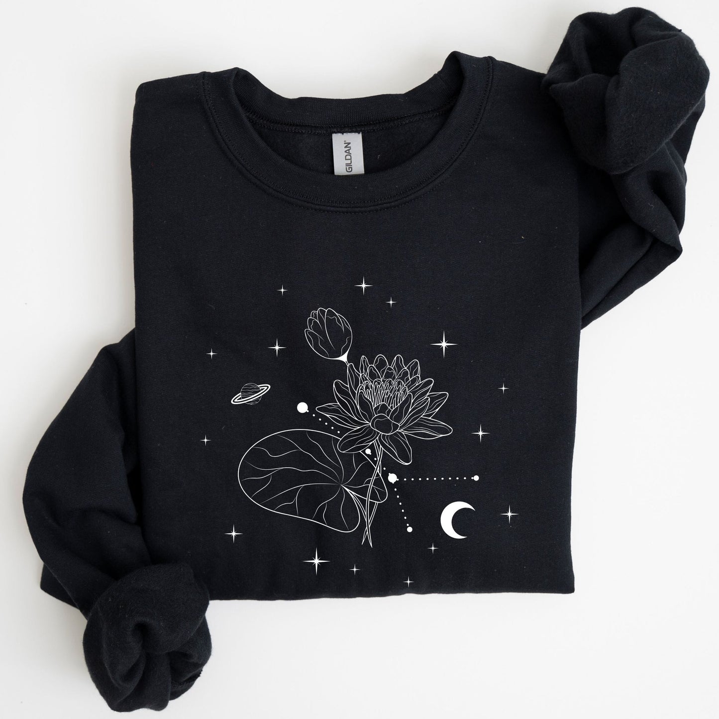 Black sweatshirt with celestial design on a white background