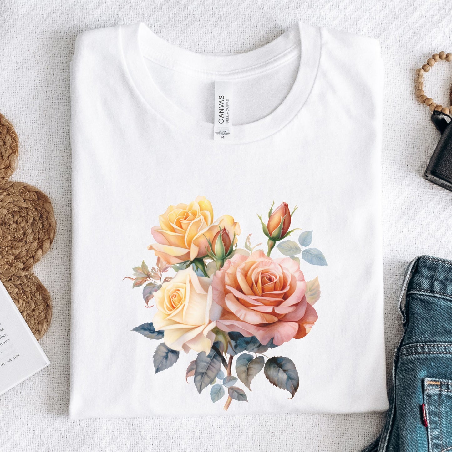 White t-shirt with floral design on a white surface