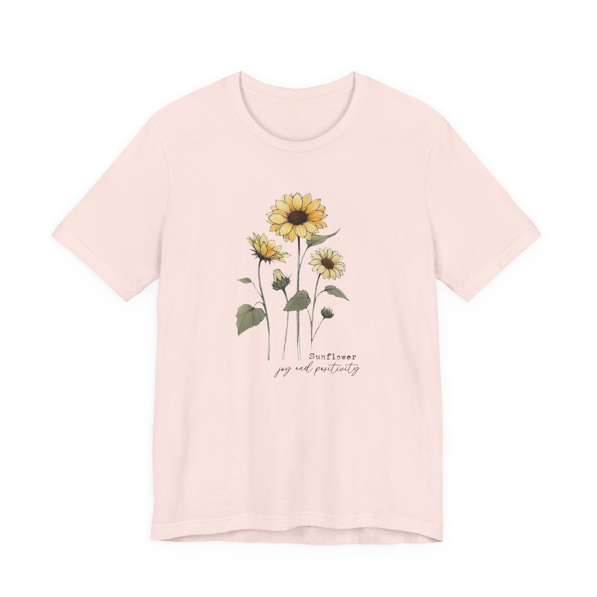 Pink t-shirt with sunflower design and text on a white background