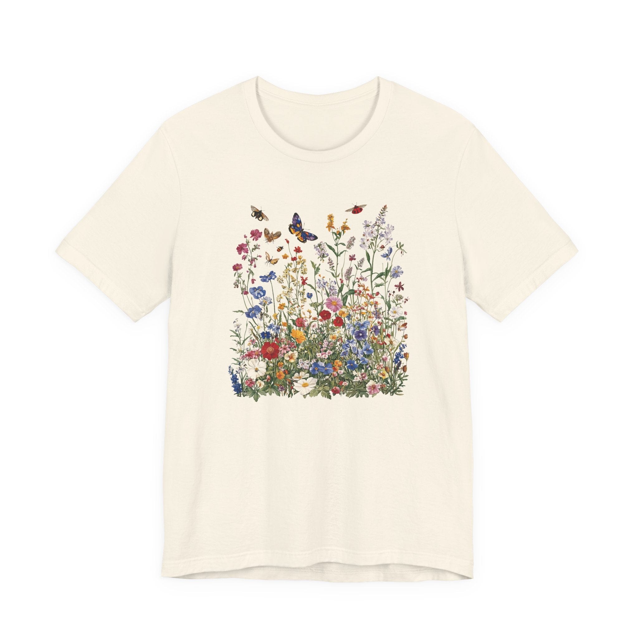 Flat lay of natural t-shirt featuring colorful wildflower meadow with butterflies