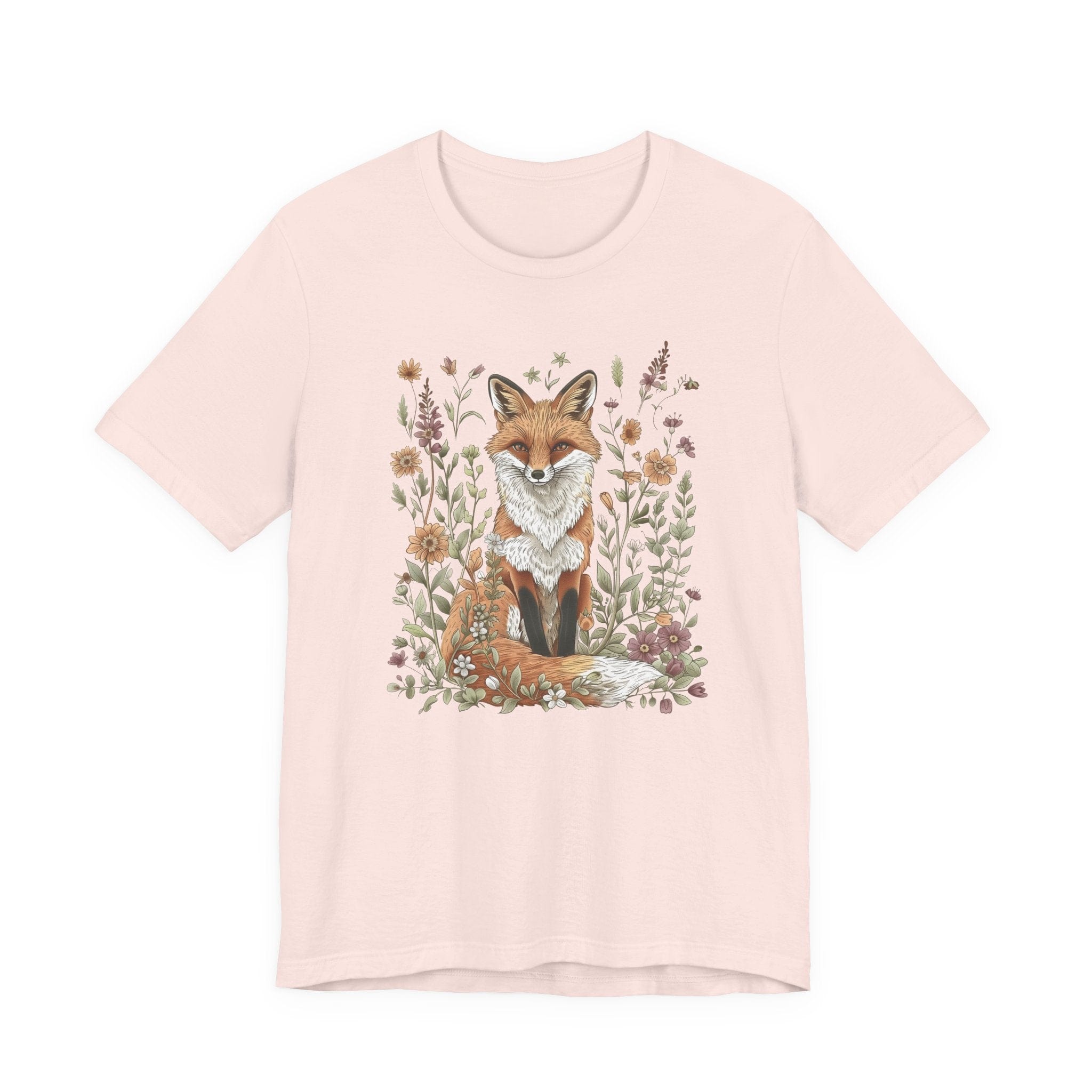 Flat lay of soft pink t-shirt featuring woodland fox surrounded by flowers