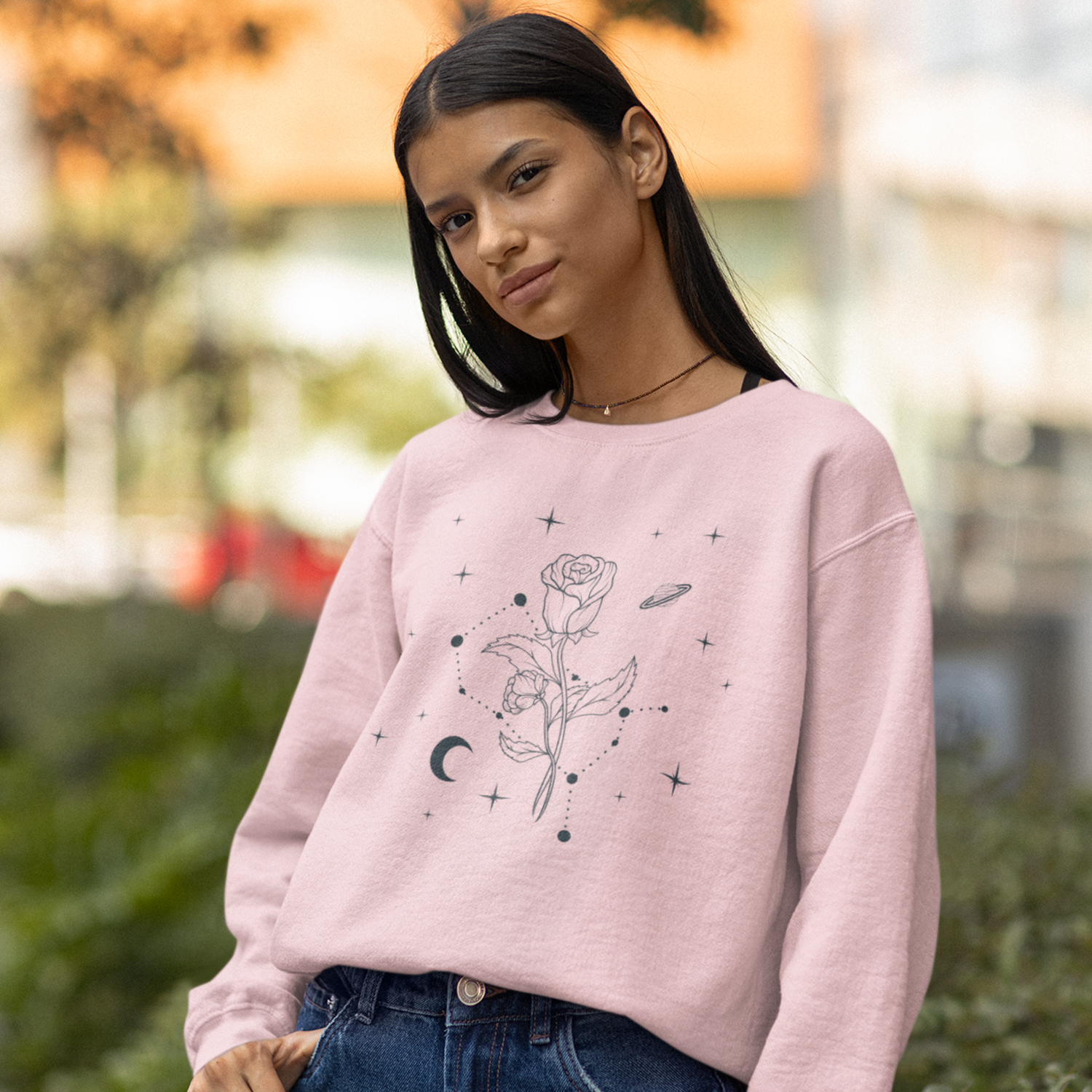 Birth flower botanical sweatshirt featuring a soft pink design with vintage floral constellation artwork inspired by celestial and nature aesthetics.