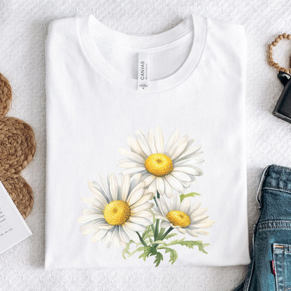 White t-shirt with daisy flower design on a light gray surface