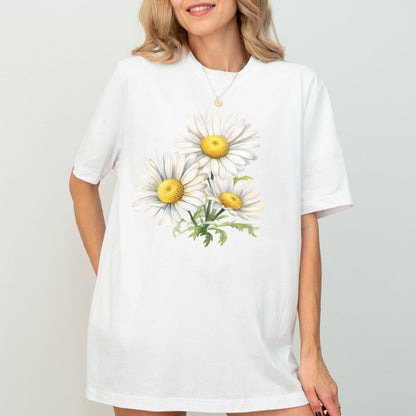 White t-shirt with daisy flower design worn by a model on a plain background