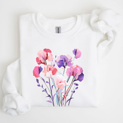 White sweatshirt with a colorful floral design on a light background