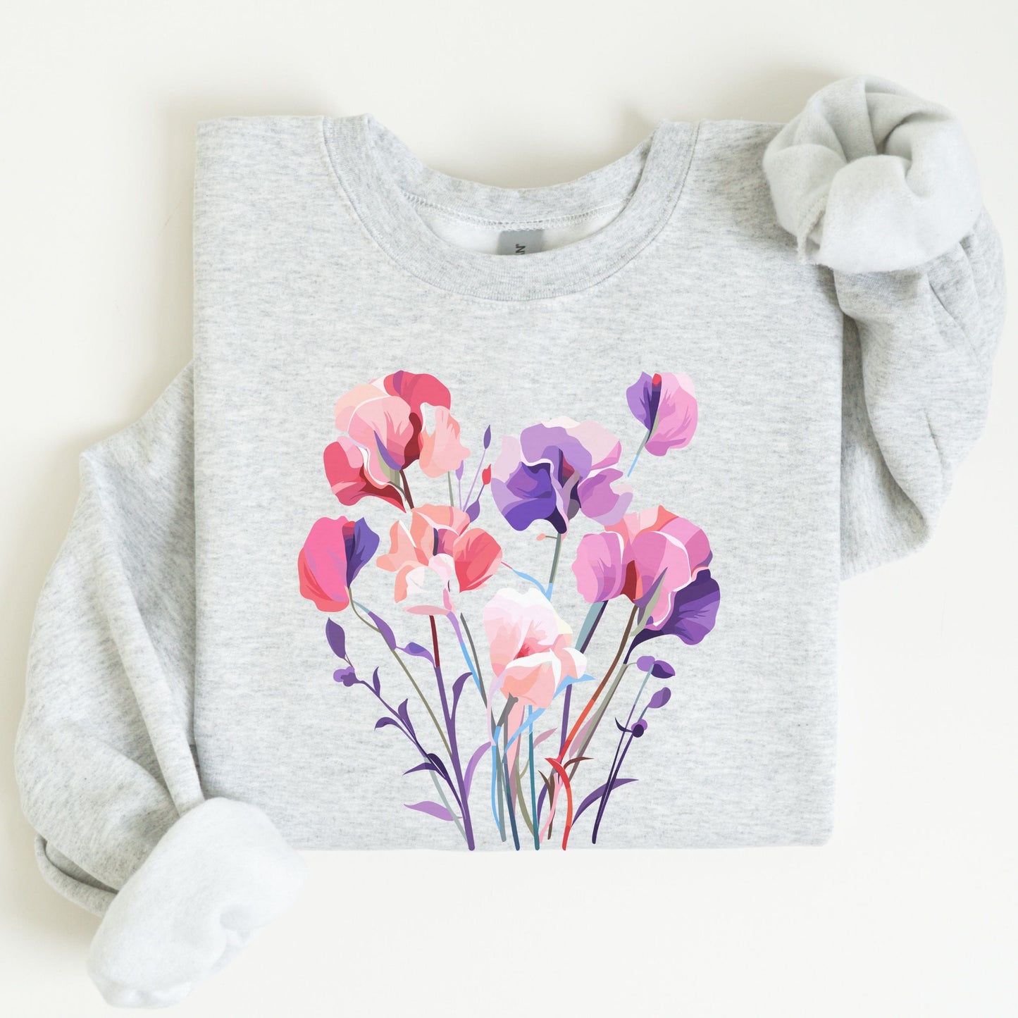 Gray sweatshirt with a colorful floral design on a white background