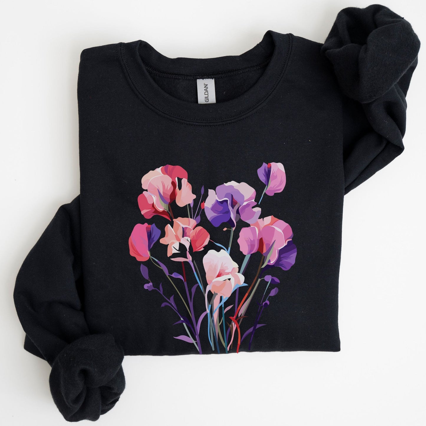 Black sweatshirt with colorful floral design on a white background