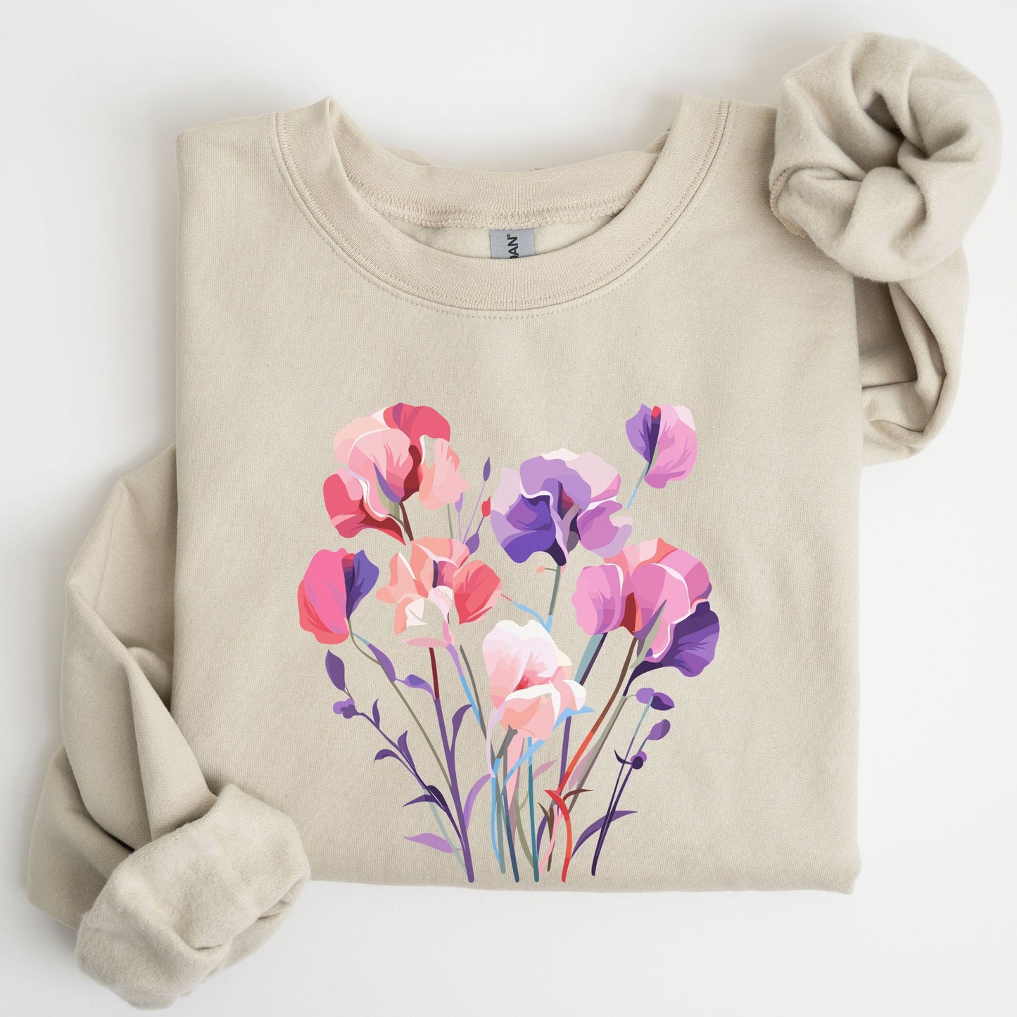 Beige sweatshirt with a colorful floral design on a white background