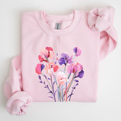 Pink sweatshirt with floral design on a light gray background