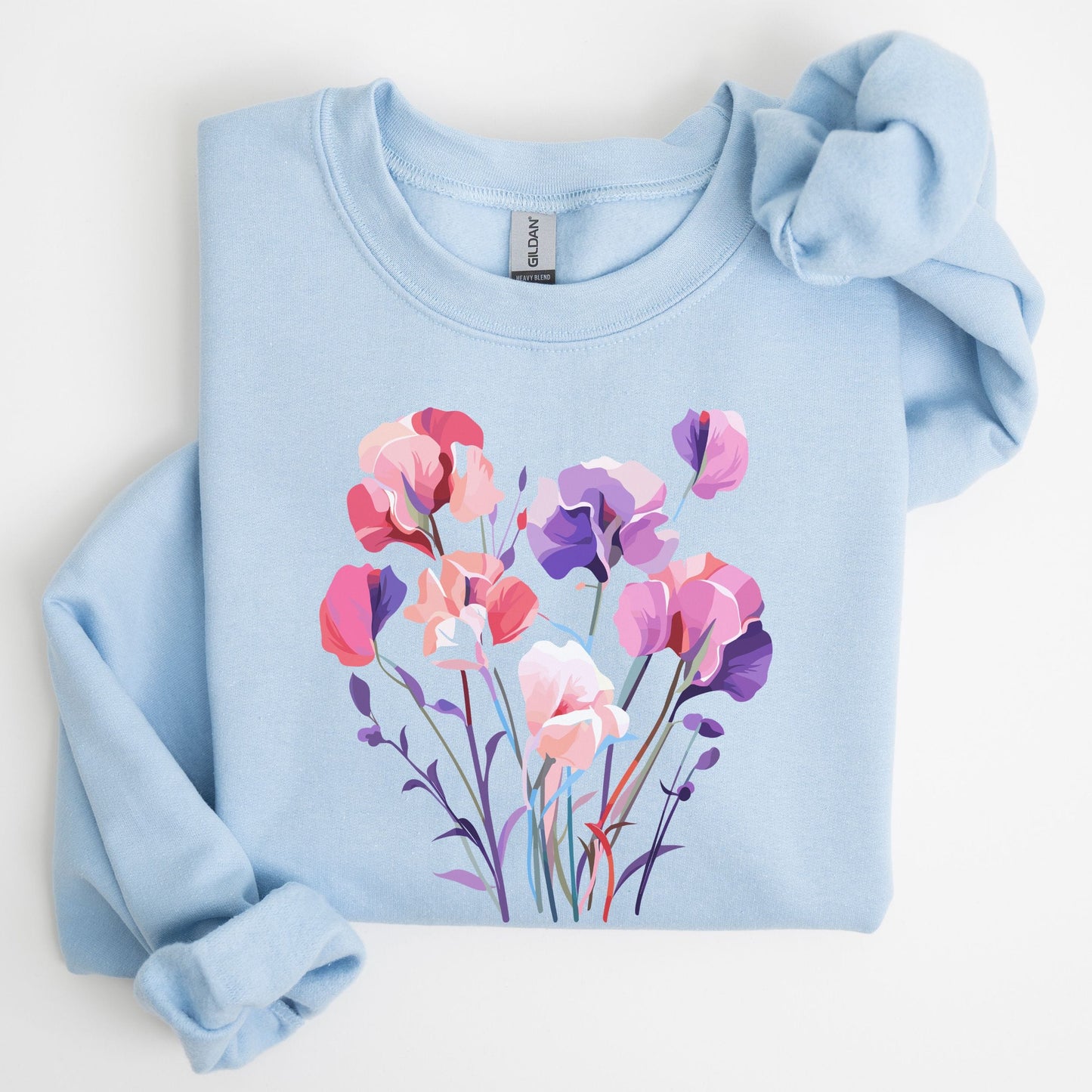 Light blue sweatshirt with floral design on a white background