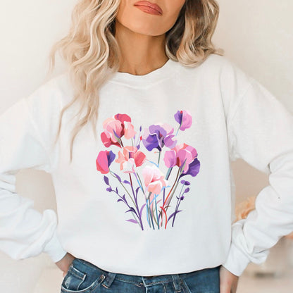 White sweatshirt with a colorful floral design worn by a person.
