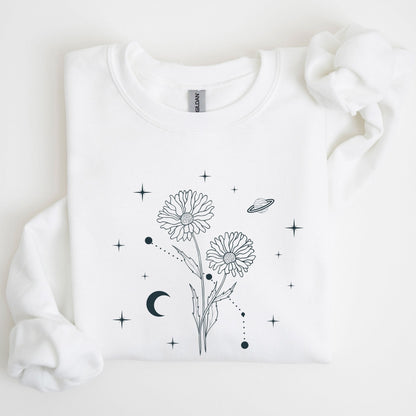 White sweatshirt with black floral and celestial design on a light background
