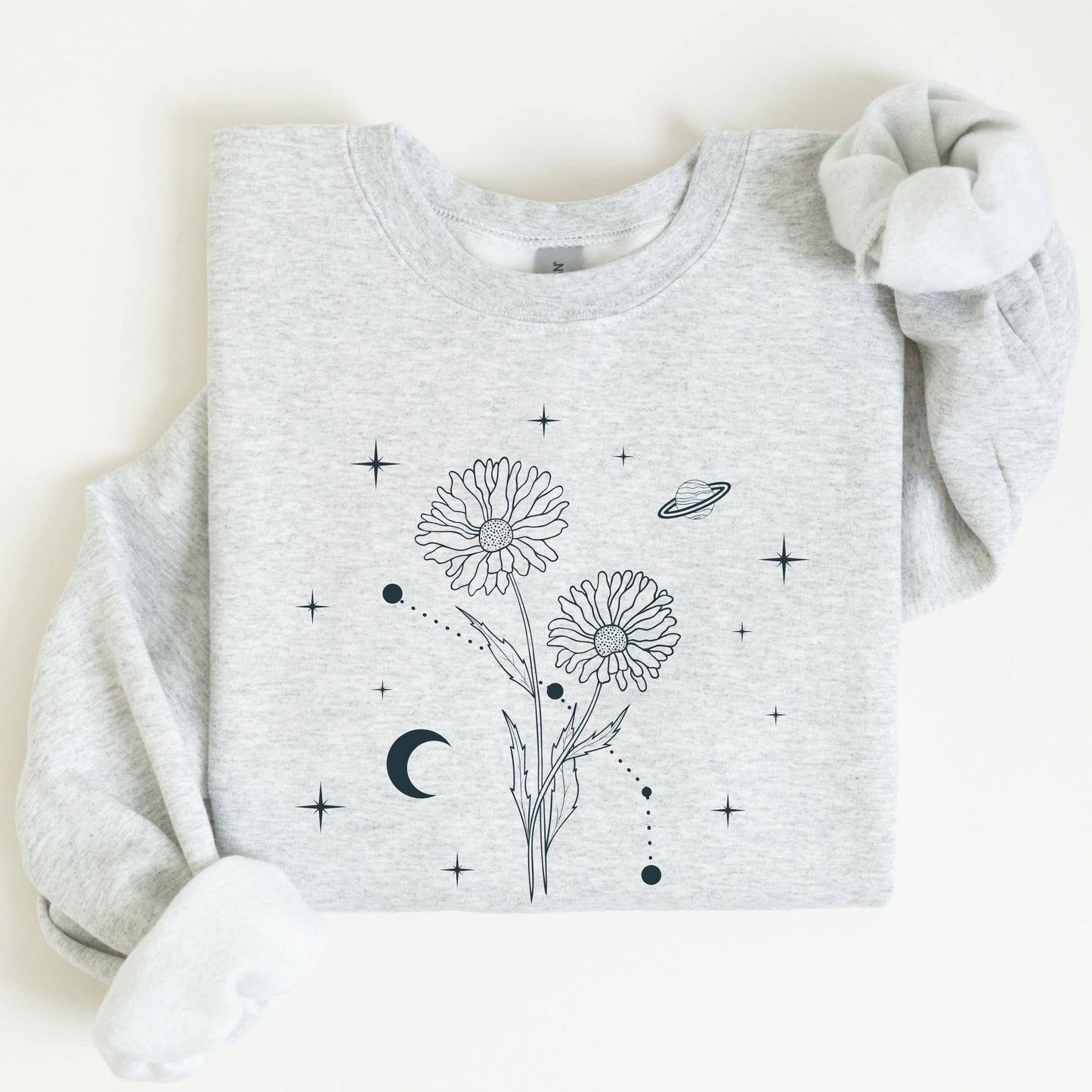 Gray sweatshirt with floral and celestial design on a white background