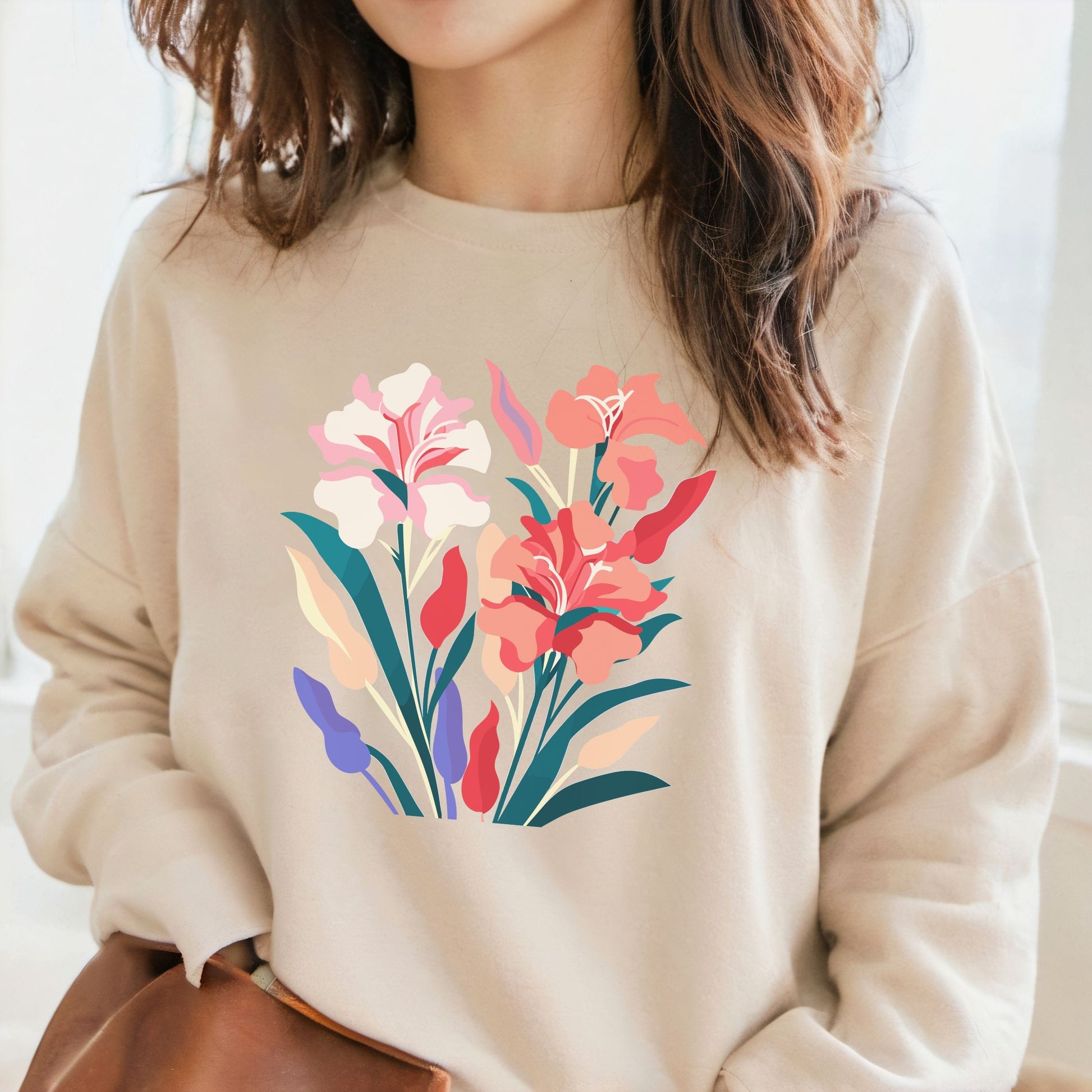 Beige sweatshirt with floral design worn by a person