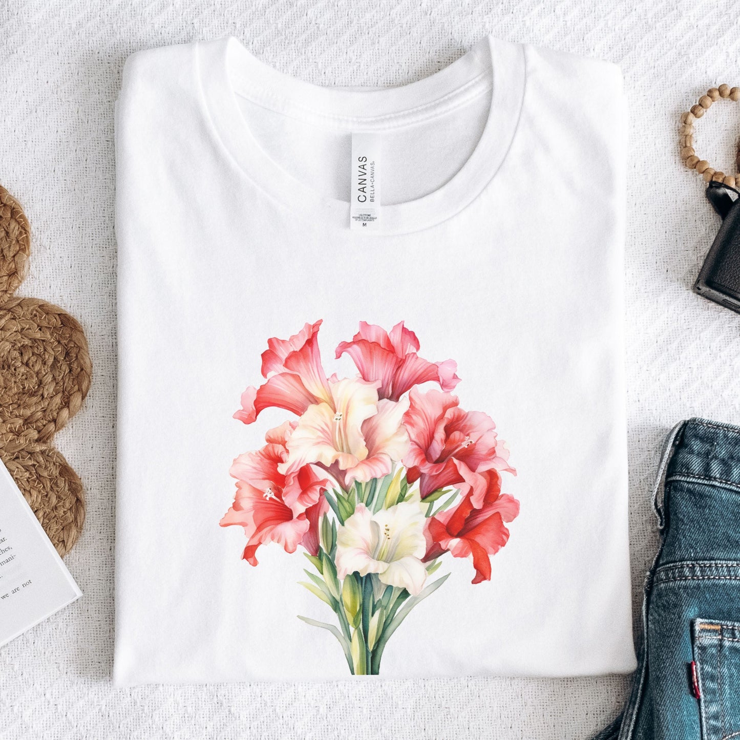 White t-shirt with a floral design on a textured surface