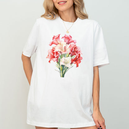 Woman wearing a white t-shirt with a floral design on a plain background