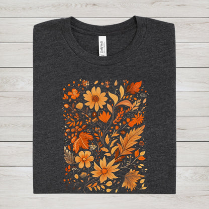 Flat lay of dark grey heather t-shirt featuring orange and gold autumn floral design