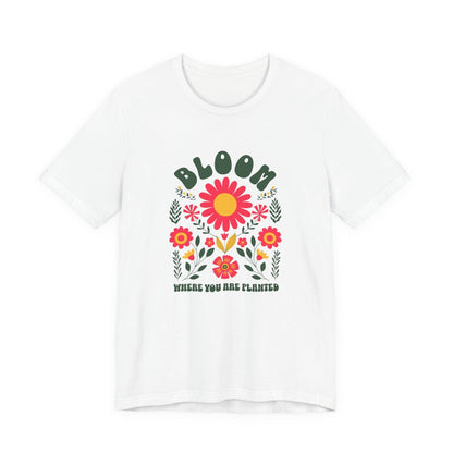 White t-shirt with floral design and text on a white background