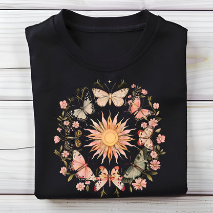 Black long sleeve t-shirt with butterfly and floral design on a wooden surface