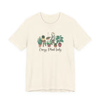Beige t-shirt with plant graphic and text on a white background