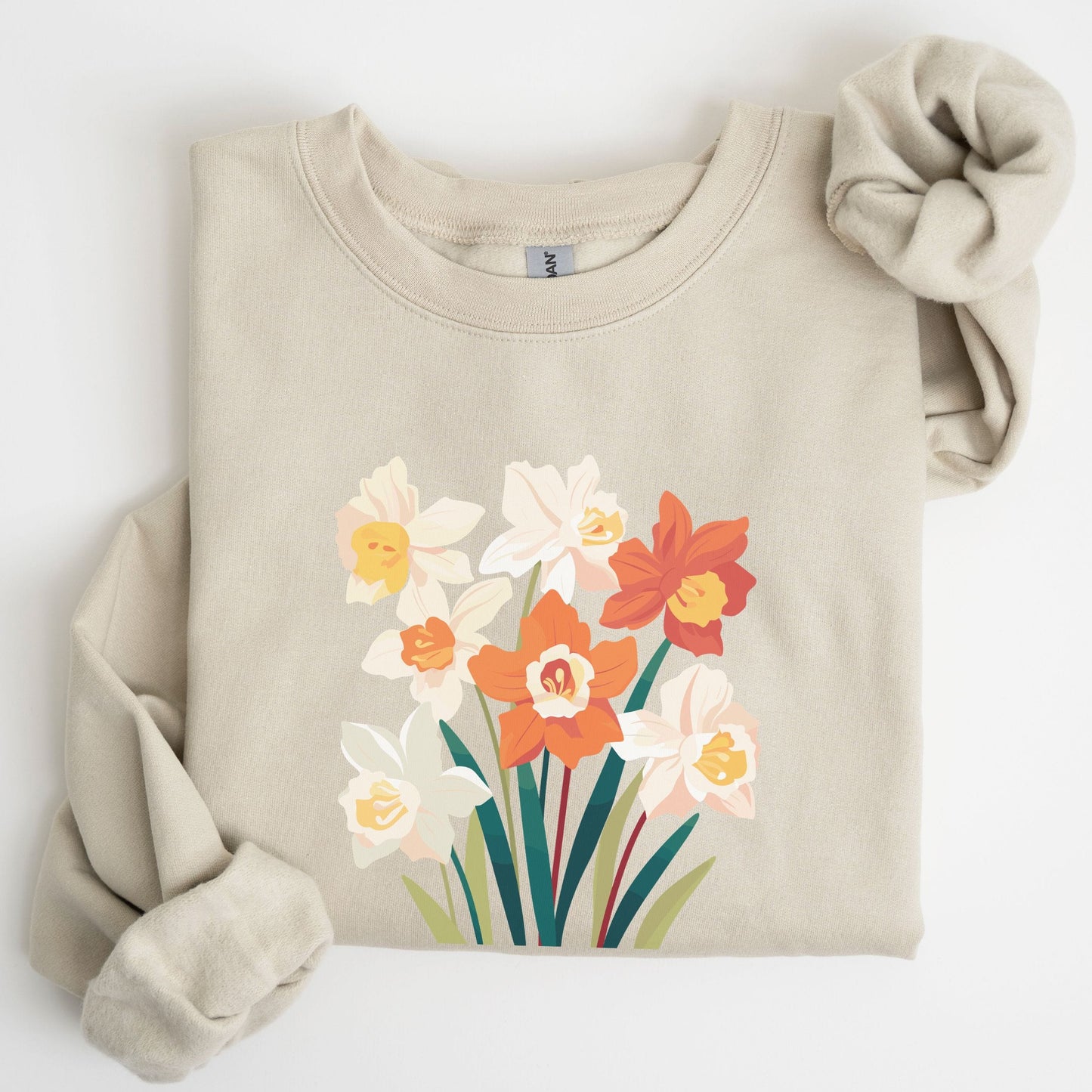 Beige sweatshirt with floral design on a white background