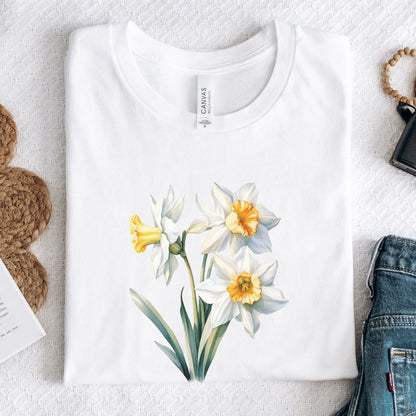 White t-shirt with floral design on a light gray surface