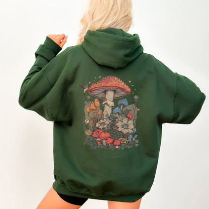 Green hoodie with a colorful mushroom design on the back, worn by a person.
