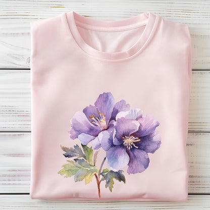Pink t-shirt with a purple floral design on a wooden surface