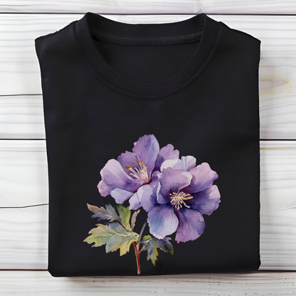 Black t-shirt with a purple floral design on a wooden surface
