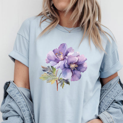 Light blue t-shirt with a purple floral design worn by a person.