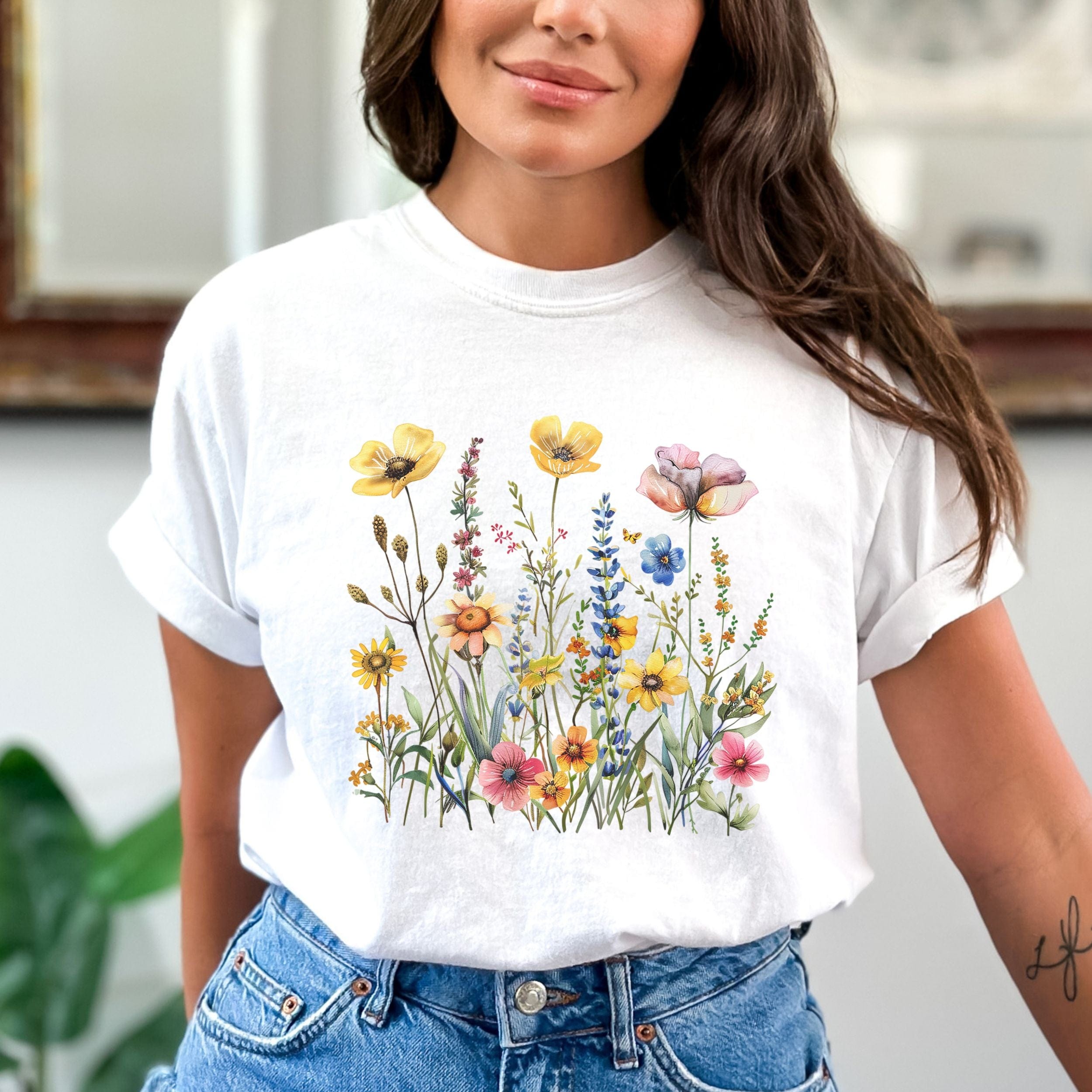 Woman wearing a white t-shirt with floral design in a casual setting