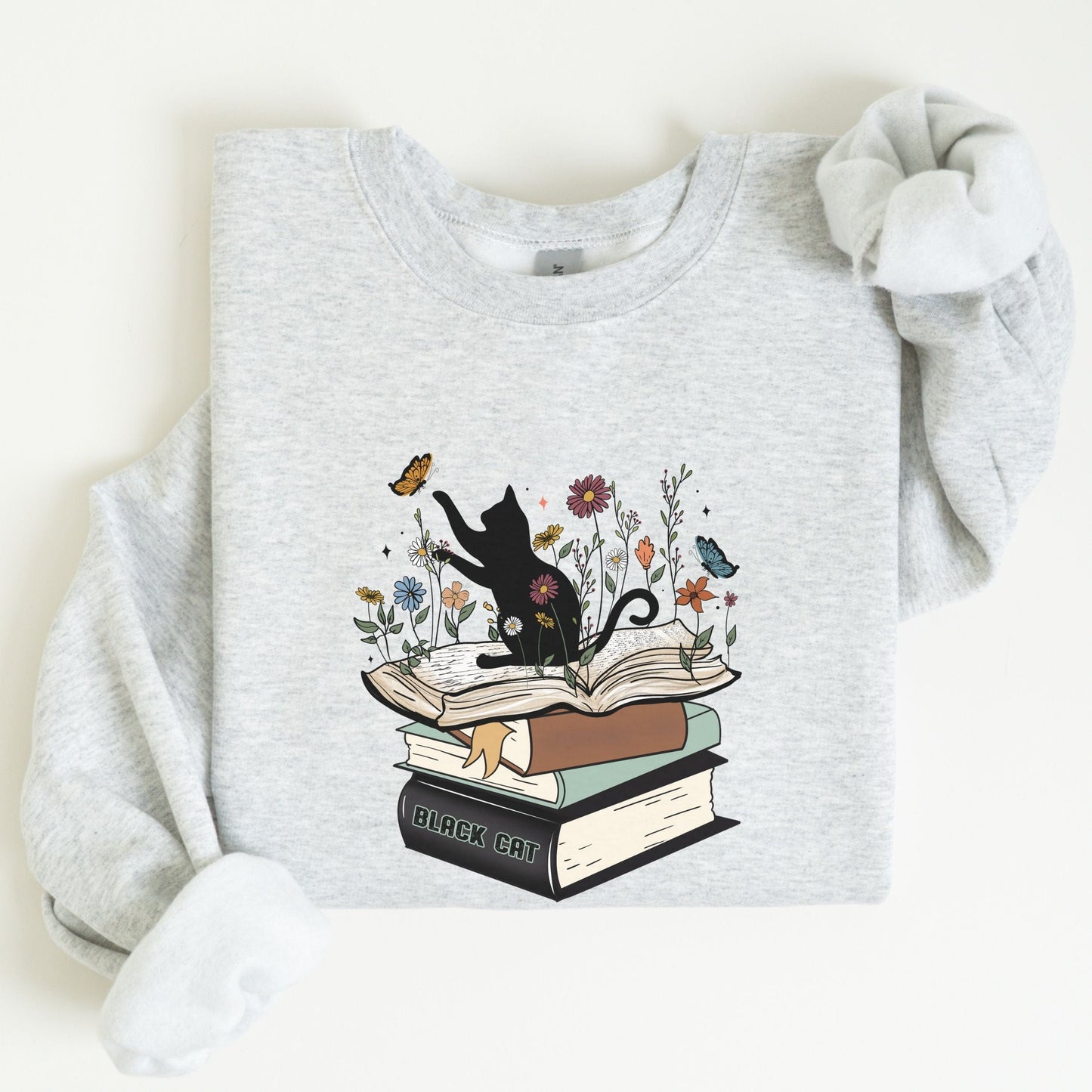 Gray sweatshirt with a black cat and books design on a white background