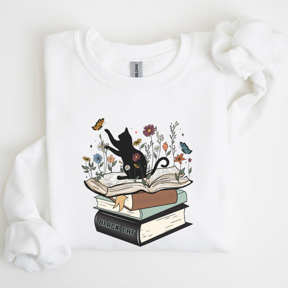 White sweatshirt with a black cat and book design on a white background