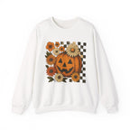 White sweatshirt with a Halloween-themed design featuring a pumpkin and flowers on a white background.
