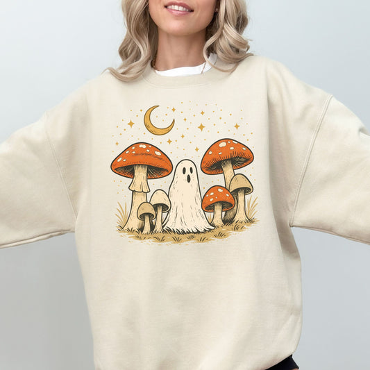 Person wearing a cream sweatshirt with a ghost and mushroom design.
