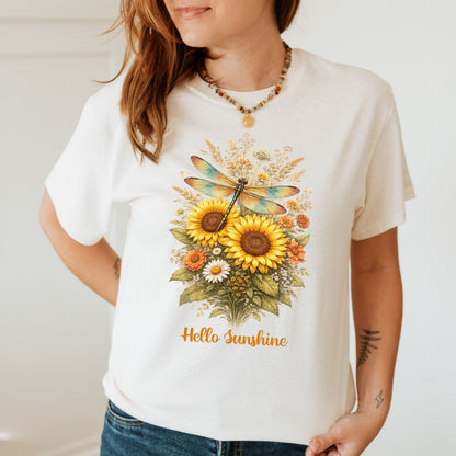 Person wearing a white t-shirt with a floral design and 'Hello Sunshine' text.
