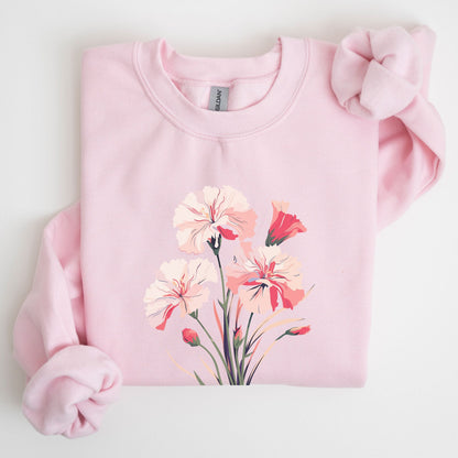 Pink sweatshirt with floral design on a light gray background