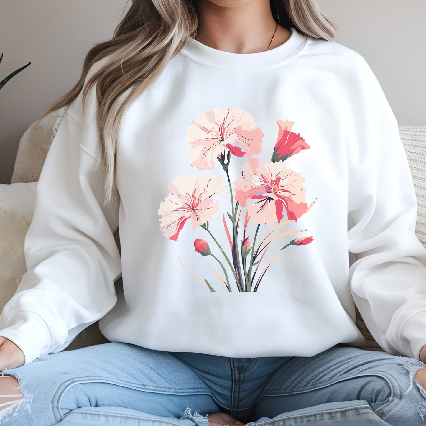 Person wearing a white sweatshirt with floral design