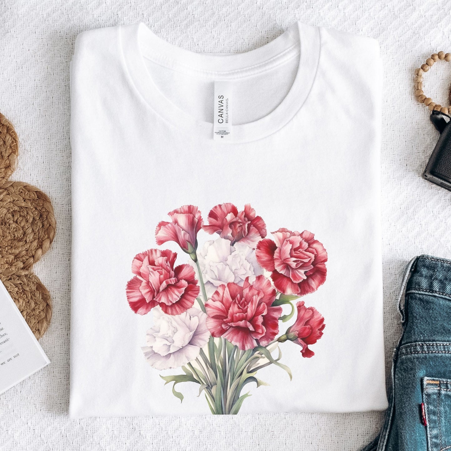 White t-shirt with a floral design on a textured surface