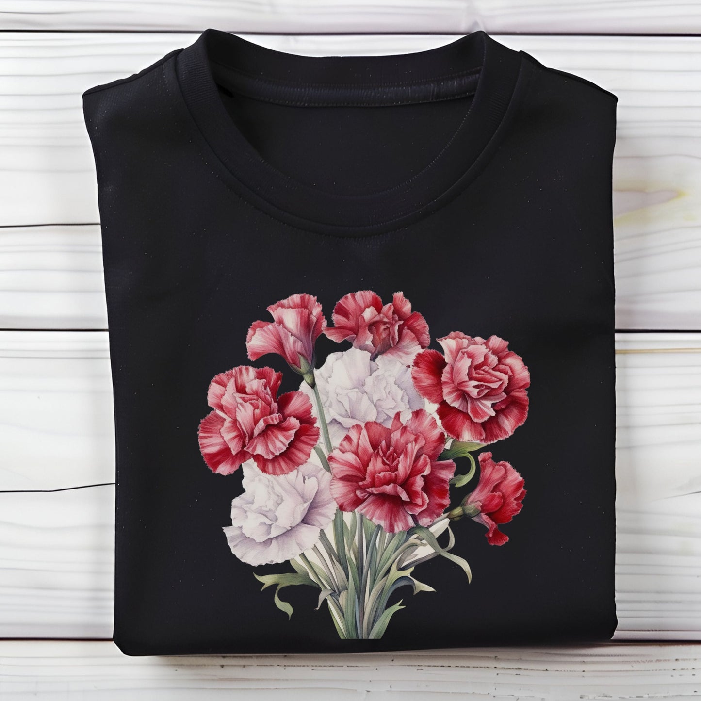 Black t-shirt with a floral design on a wooden surface