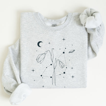 Gray sweatshirt with black floral and celestial design on a white background