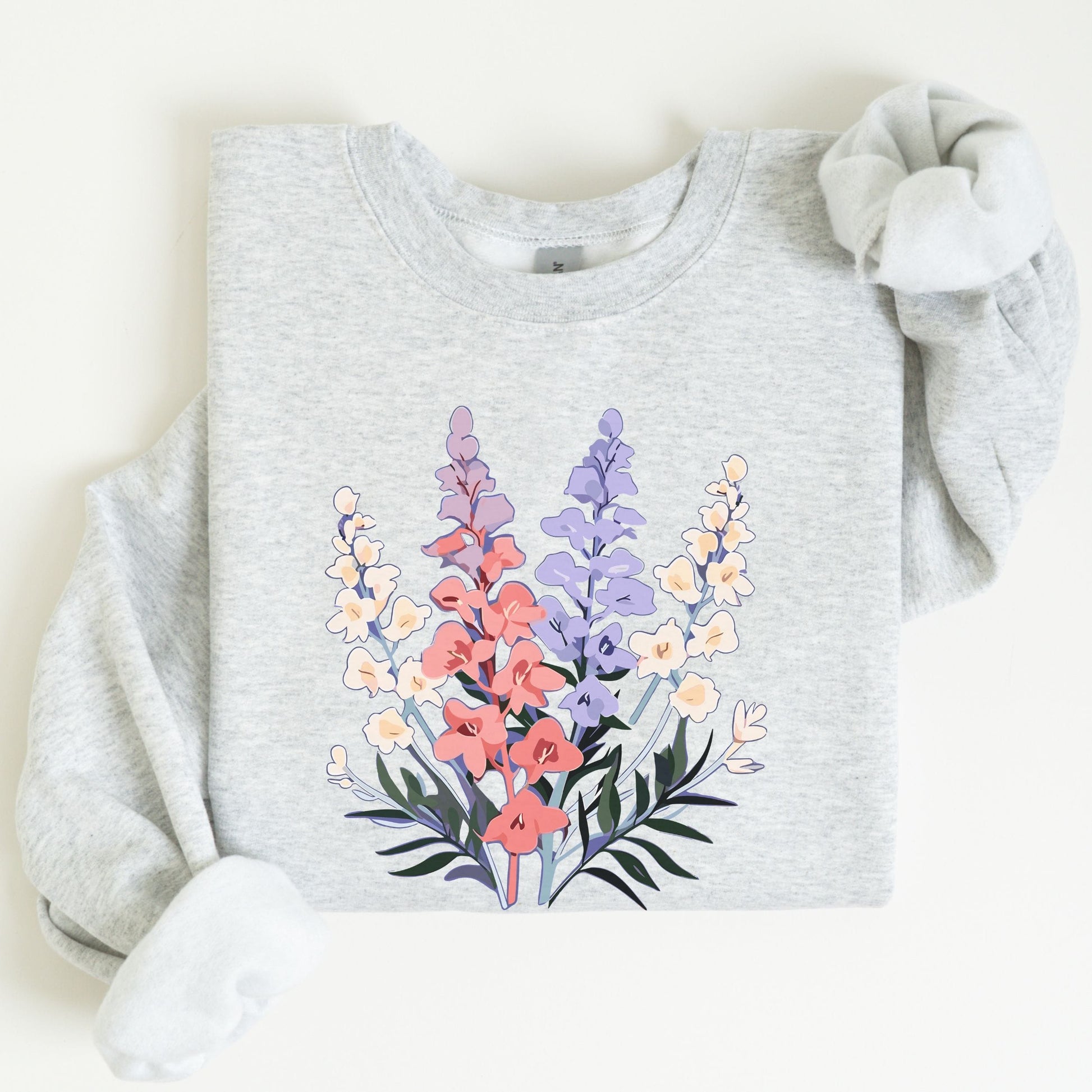 Gray sweatshirt with a colorful floral design on a white background