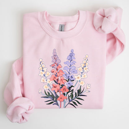 Pink sweatshirt with floral design on a light gray background