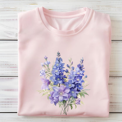 Pink t-shirt with a floral design on a wooden surface