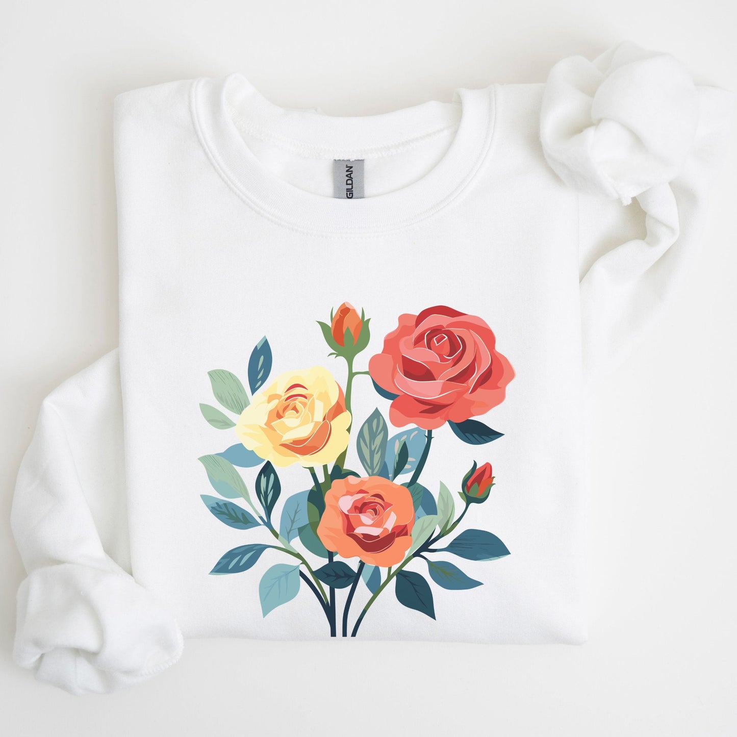 White sweatshirt with colorful floral design on a light background