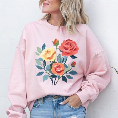 Person wearing a pink sweatshirt with floral design against a white background
